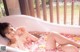 A woman laying in a bathtub filled with rose petals.