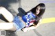 A woman laying on the ground with her legs crossed.